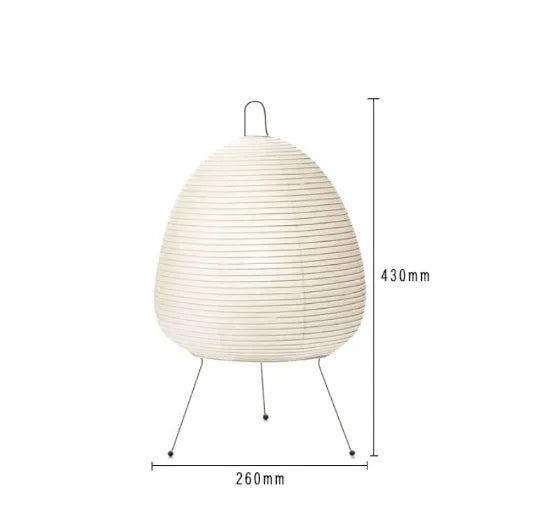 Japanese style table lamp with a white handmade rice paper shade on a slim aluminium base.