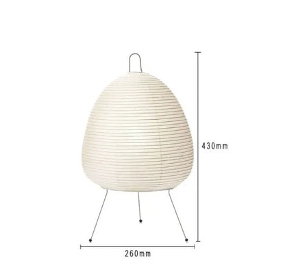 Japanese style table lamp with a white handmade rice paper shade on a slim aluminium base.