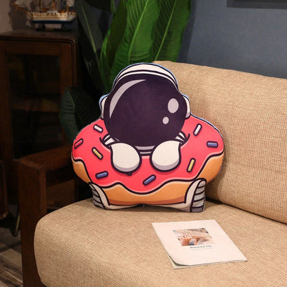 Soft plush astronaut pillows in various space-themed designs, including rockets, spacecraft, and more