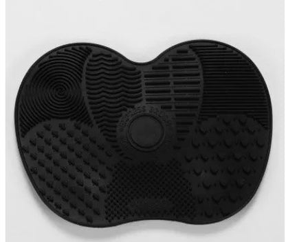 Silicone makeup brush cleaning pad, 15.5 x 12 cm, shown as a coloured brush cleaner mat for cleansing makeup brushes.