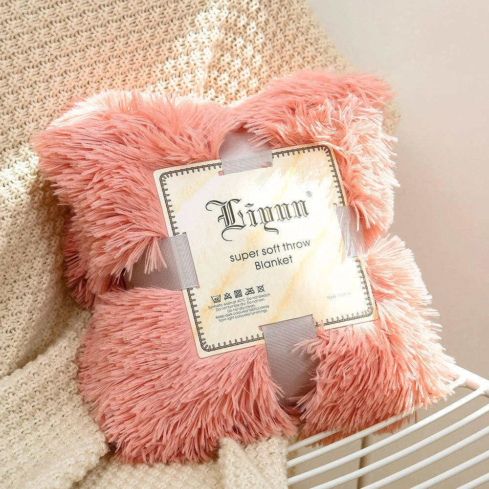 Soft coral fleece blanket in various colours and sizes for home and travel comfort