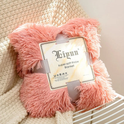 Soft coral fleece blanket in various colours and sizes for home and travel comfort