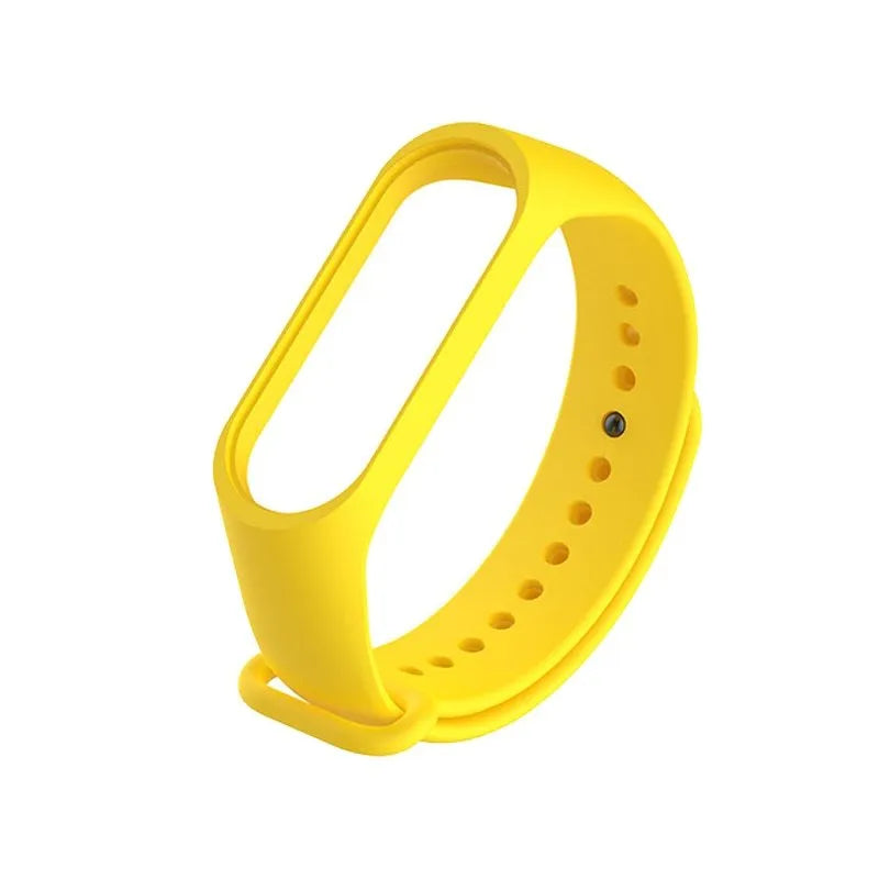 Colourful silicone replacement strap for XIAOMI MI Band 3 smart watch on a wrist.