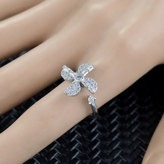 Adjustable spinner ring with rotating floral, geometric, and nature-inspired motifs for women's fashion and stress relief