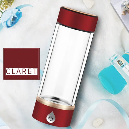 Portable hydrogen water ionizer bottle with high borosilicate glass cup in silver finish.