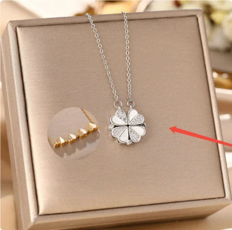 Exclusive four-leaf clover pendant necklace in stainless steel with crystal heart charm, a versatile jewellery piece for women
