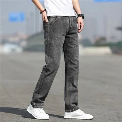 Men's smoky gray straight leg jeans with high elasticity fabric and low waist design