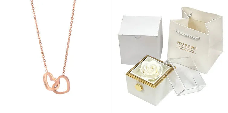 Rotating rose jewellery gift box with a preserved red rose under a clear acrylic dome, showing the interior rotating drawer.