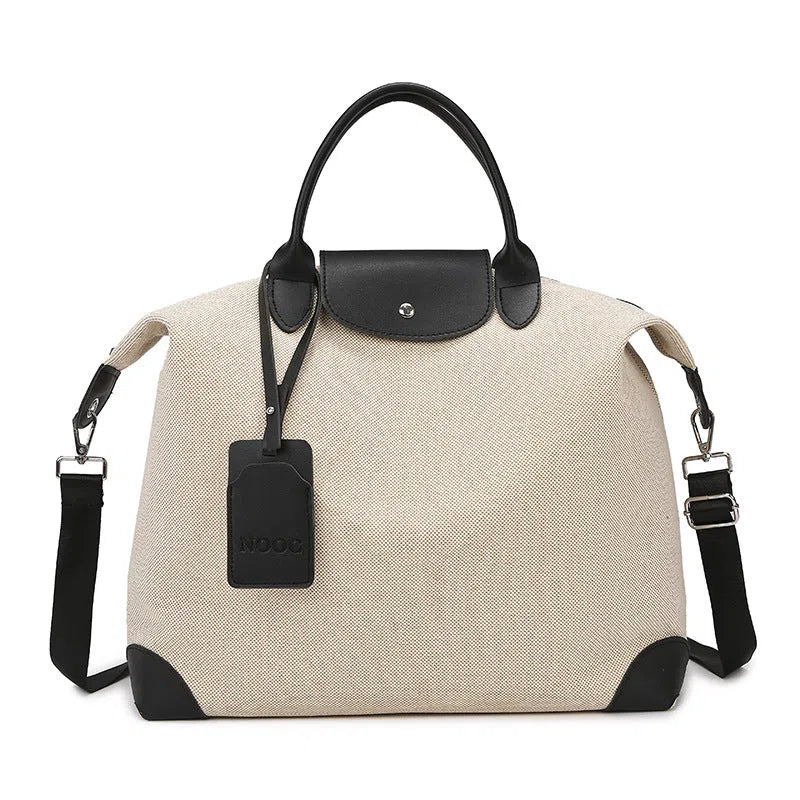 Large capacity canvas yoga and fitness bag in brown, khaki, or black with polyester lining and shoulder strap.