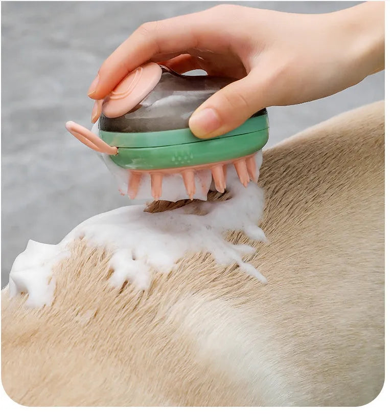 Blue and green pet bath brush with silicone bristles and a shampoo dispenser bottle in hand.