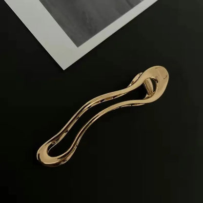 Women's zinc alloy hair barrettes in gold and silver with square, arc, and triangle shapes