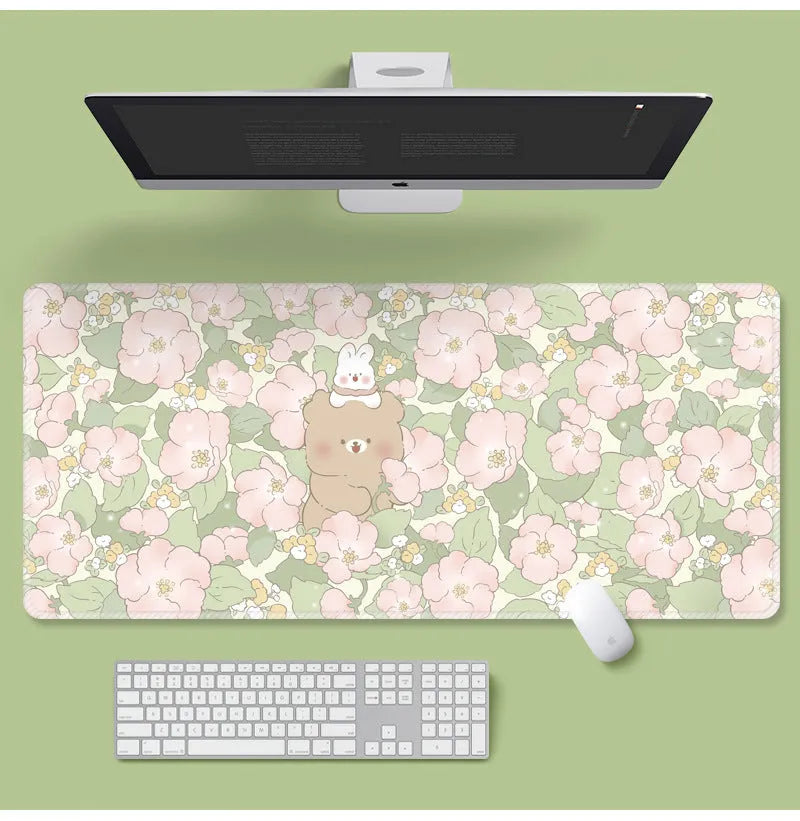 Large cartoon flower pattern mouse pad with non-slip rubber base on desk