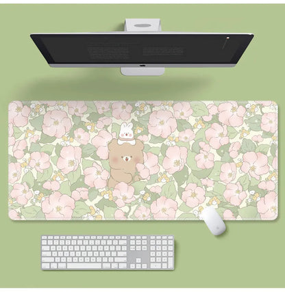 Large cartoon flower pattern mouse pad with non-slip rubber base on desk