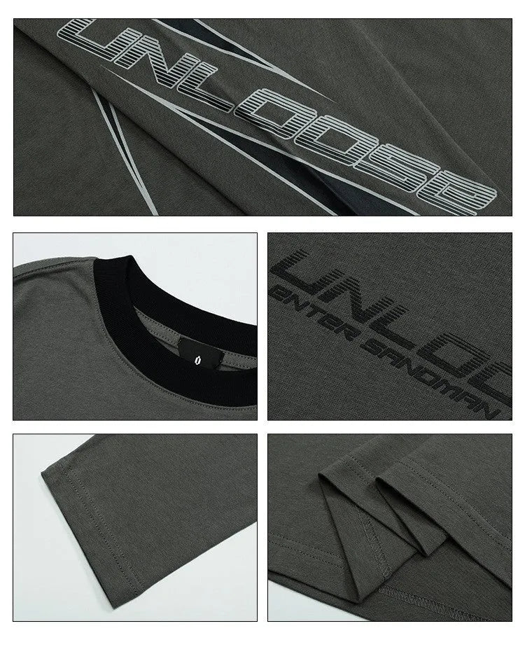 Woman wearing a grey khaki loose drop shoulder sweatshirt with a printed letter design.