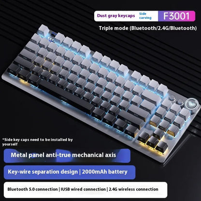 Tarantula tenkeyless wireless mechanical keyboard with side-engraved keycaps on a metal frame, showing ice blue backlighting.