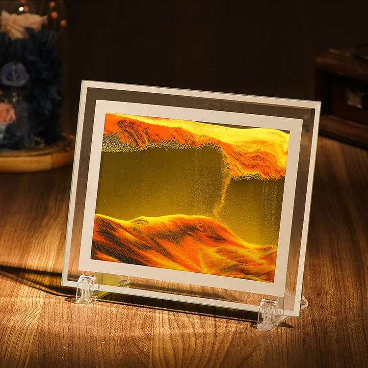 Geometric glass ornament containing a colourful quicksand landscape painting in modern style.
