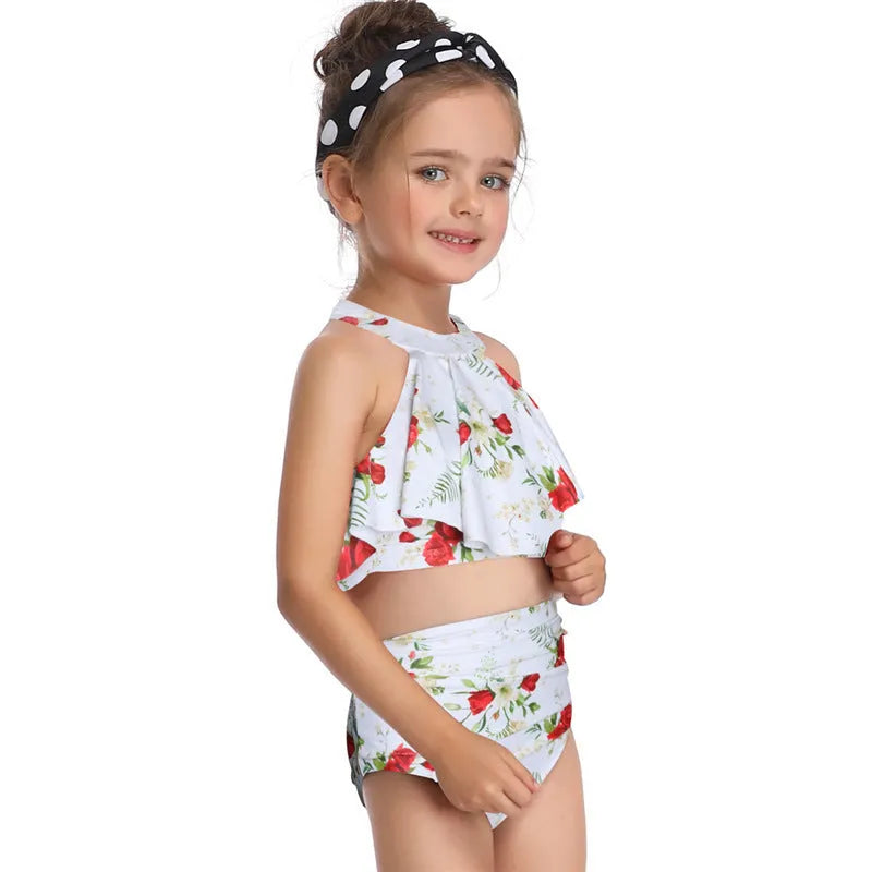 Nylon one-piece swimsuit with chest pad, available in flower, orange, and red, adult and child sizes.