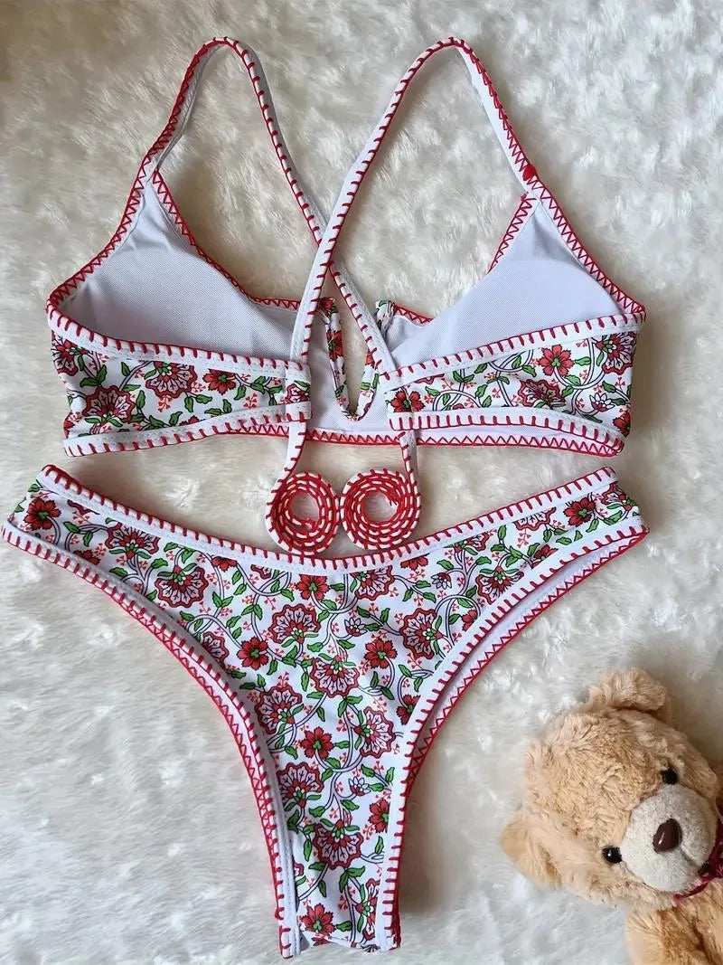 Women's floral embroidered V-neck bikini swimsuit on a mannequin