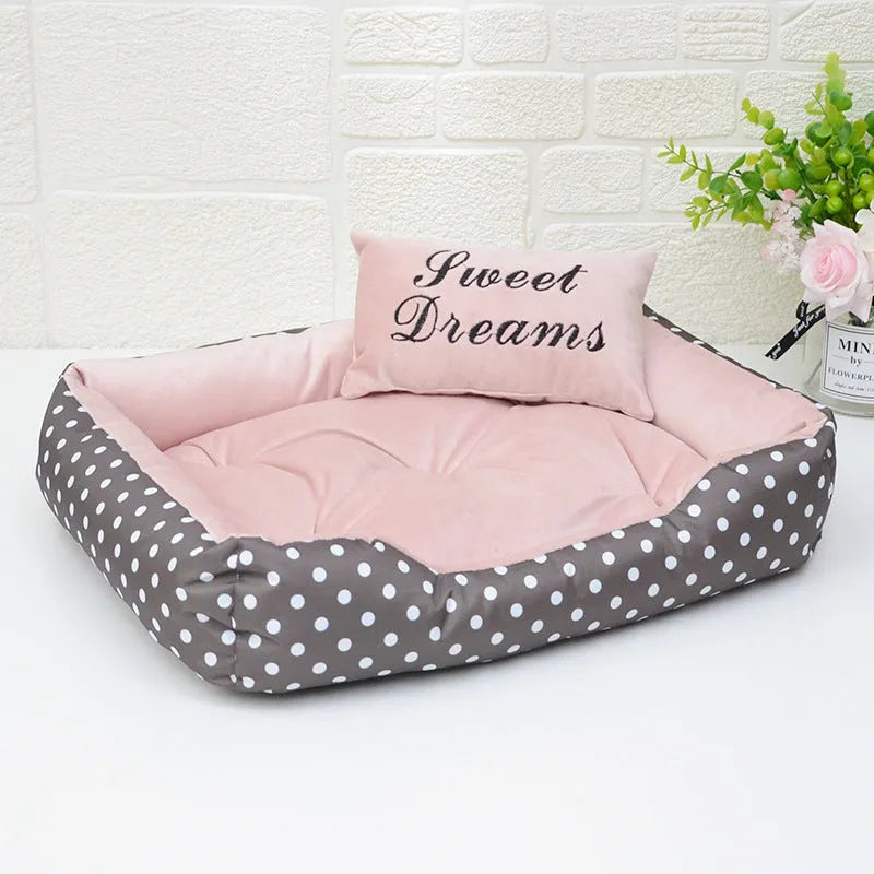 Polka dot print square nest dog bed for small dogs with a removable embroidery pillow in grey, blue, pink, or red.