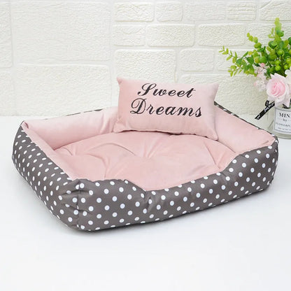 Polka dot print square nest dog bed for small dogs with a removable embroidery pillow in grey, blue, pink, or red.