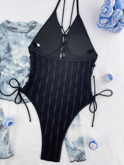 Black women's one-piece swimsuit with European American bikini styling in polyester fabric
