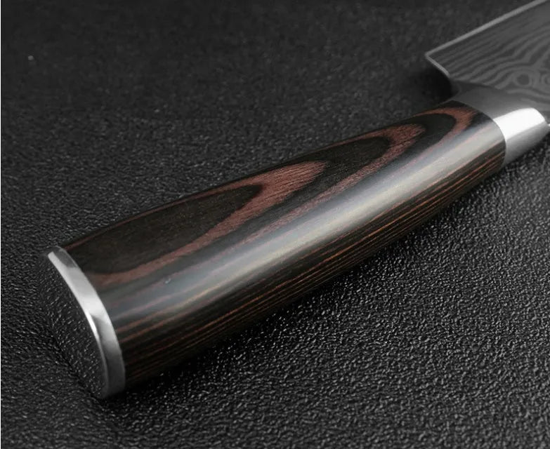 7-inch chef knife with laser Damascus pattern on blade and coloured steel handle on a cutting board.
