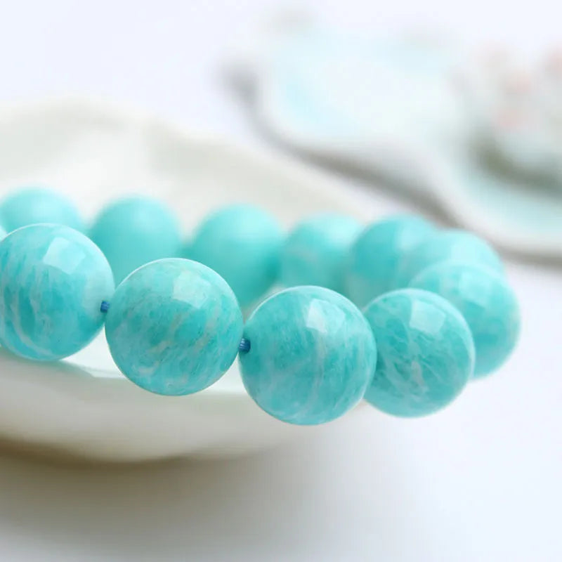 Amazonite gemstone bracelet with green-blue beads on a wrist