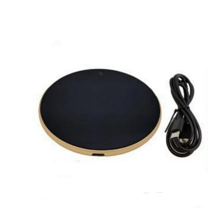Black USB heating coaster with a mug on its tempered glass surface, showing a red LED indicator light.