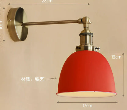 Bedroom wall light with 15cm wide iron shade in pink colour, mounted 20cm projection for soft illumination