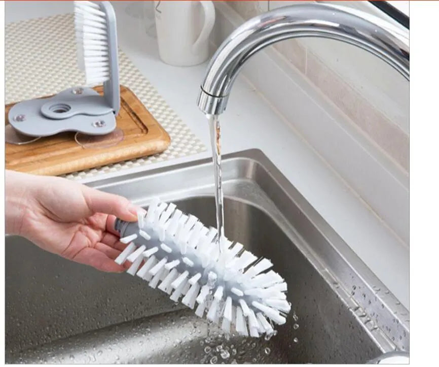 Grey suction cup brush with double-head design for cleaning cups and glasses
