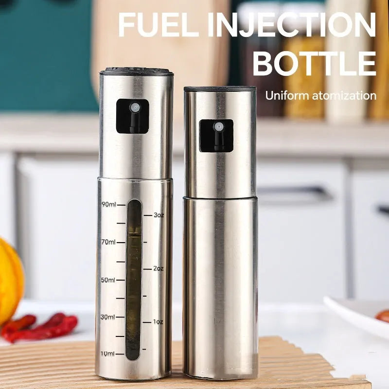 Glass oil spray bottle with stainless steel press cap showing 100ml capacity