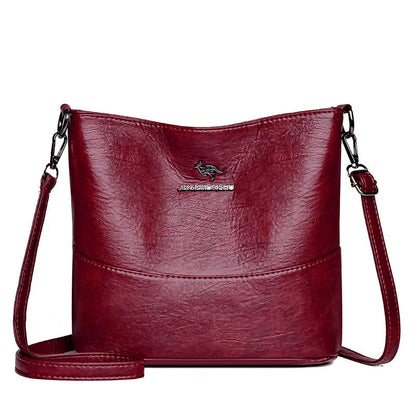 Women's soft leather bucket shoulder bag in black, wine red, or ginger yellow with large capacity and minimalist design