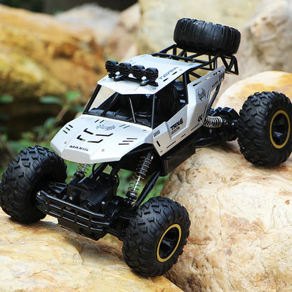 Four-wheel drive remote control car with 2.4G wireless controller on rough terrain