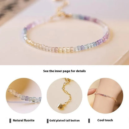 Handmade women's bracelet with rainbow fluorite stone in geometric copper links.