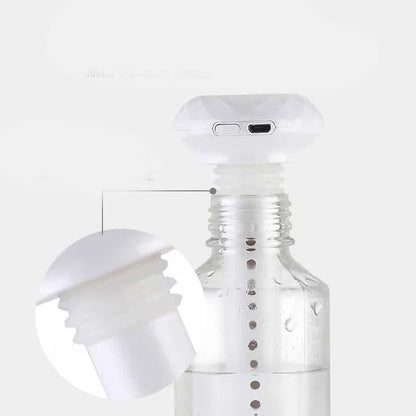 White columnar USB humidifier diffuser with 54mm diameter next to car cup holder