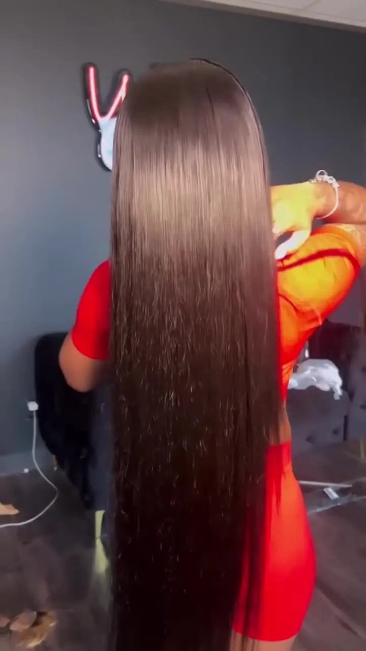 A long, straight human hair wig with a 13x4 lace front and centre-parted bangs, shown in a natural colour.
