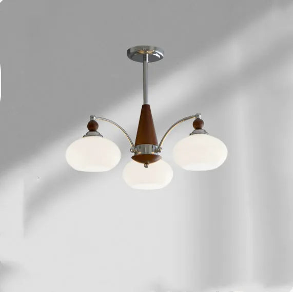 Persimmon glass chandelier with chrome frame in Middle Ancient style, shown with multiple glass shades.