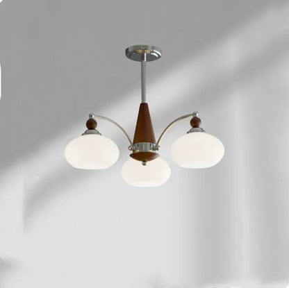 Persimmon glass chandelier with chrome frame in Middle Ancient style, shown with multiple glass shades.