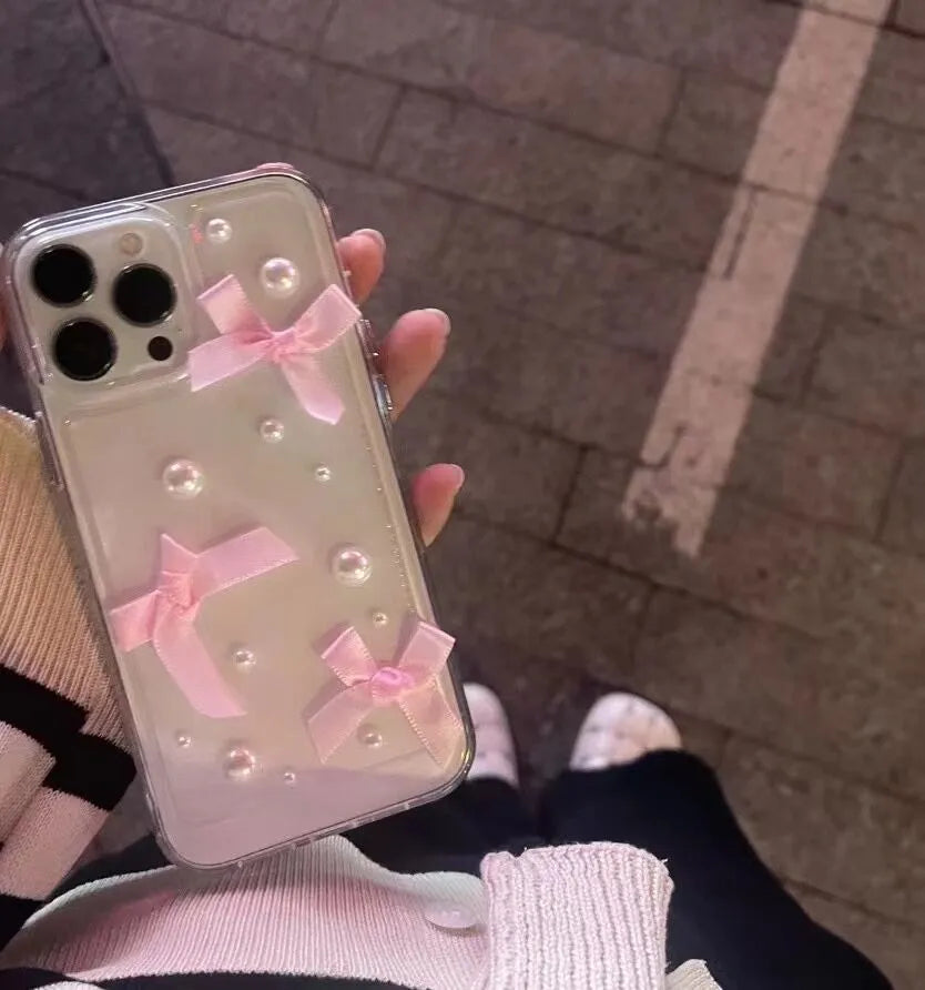 Transparent TPU iPhone case with three-dimensional pearl bow, anti-fall all-inclusive design, colour-matching finish