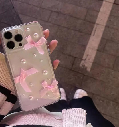 Transparent TPU iPhone case with three-dimensional pearl bow, anti-fall all-inclusive design, colour-matching finish