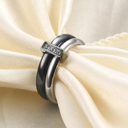 Women's ceramic ring with geometric design, glossy stitching, and zirconium inlay in steel black or gold white finish
