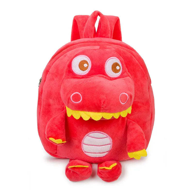 Soft blue plush children's backpack with an embroidered green dinosaur character and a soft handle.