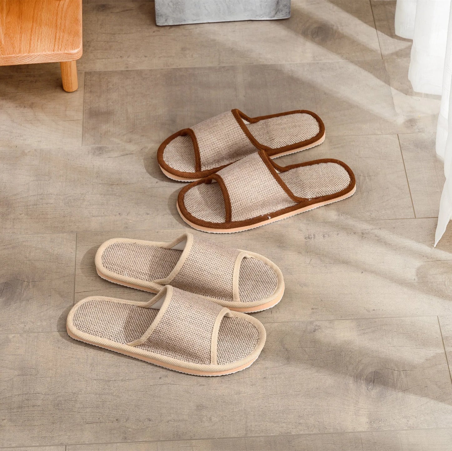 Women's open-toe linen slippers with thick sole in light brown colour.
