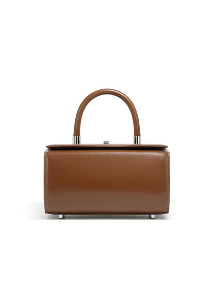 Women's leather one-shoulder crossbody bag in cowhide with clamshell design and internal phone pocket