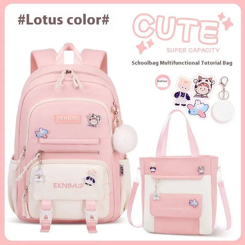 Pink waterproof Oxford cloth school backpack for girls with curved straps on a bookshelf.