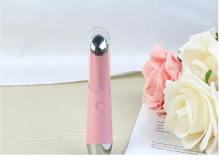 Mini electric vibration eye massager pen in pink and white with 40°C thermal head and USB charging cable