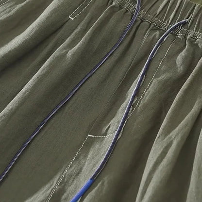 Men's linen shorts in loose straight drooping style with drawstring waist in green colour