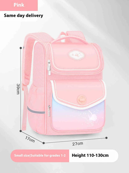 Pink girls school backpack with wide padded straps on a wooden bench, books and lunch bag inside.