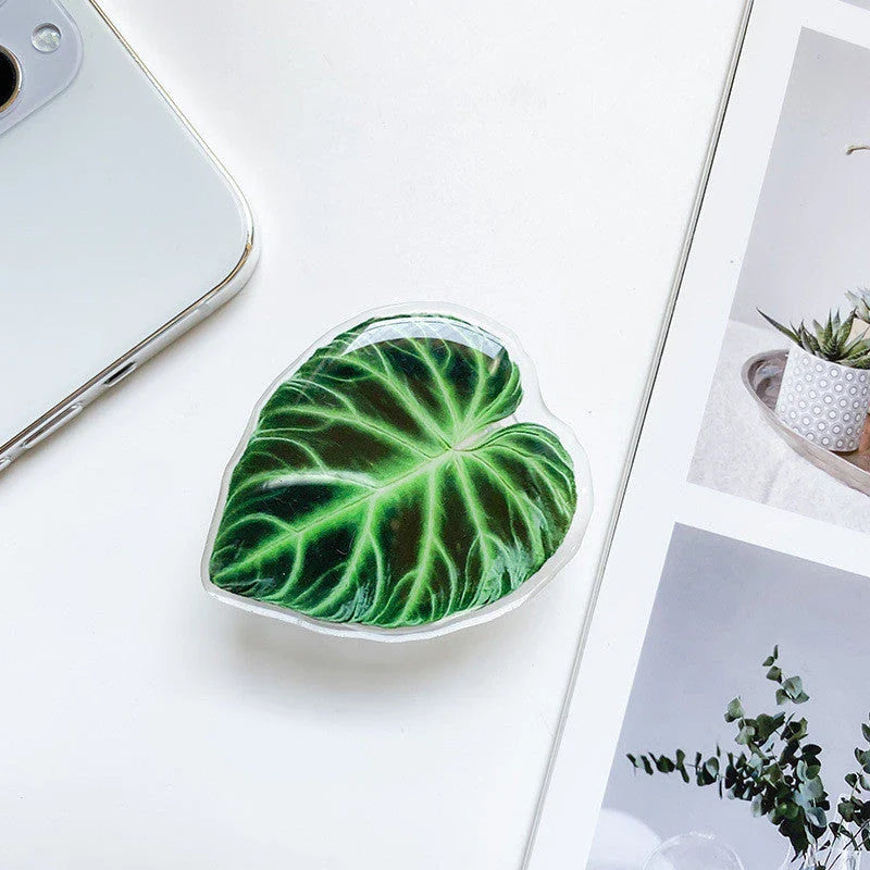 Stylish smartphone stand with leaf-inspired design for secure hands-free support and mobile device versatility