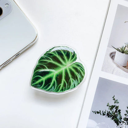 Stylish smartphone stand with leaf-inspired design for secure hands-free support and mobile device versatility